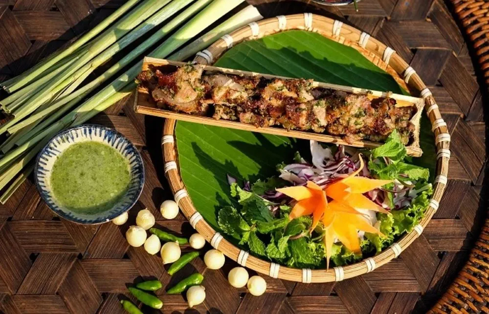 A perfect combination of grilled pork in bamboo tubes and bamboo rice