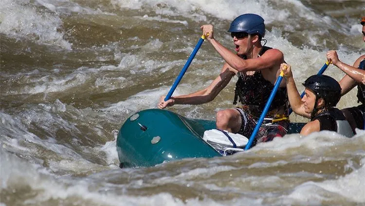 Relaxing with whitewater rafting after ATV riding adventures