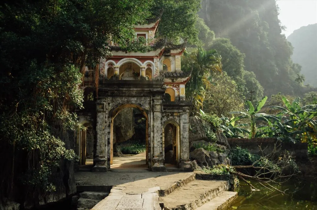 Ancient Bich Dong Pagoda nestled on a limestone mountain slope