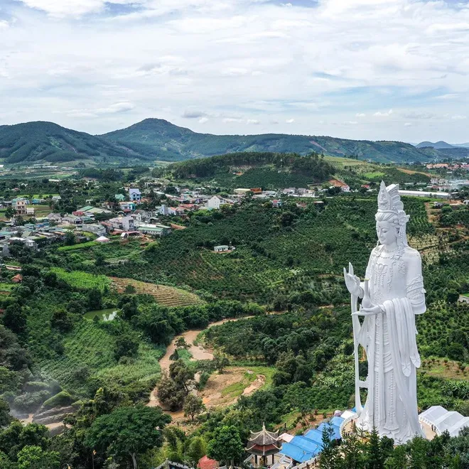 The majestic Guanyin Buddha statue, standing tall amidst Da Lat's vast mountainous landscape