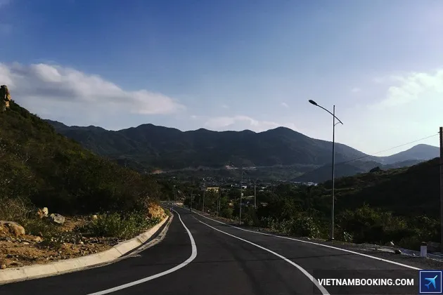 A traveler riding a motorbike on the coastal road to Vinh Hy, Vietnam