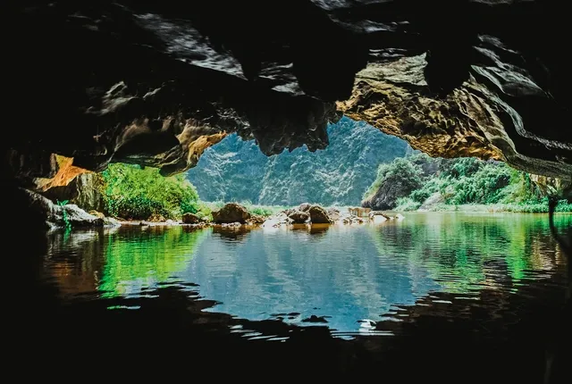 Magical cave with stalactites and stalagmites inside Ngo Dong River in Tam Coc