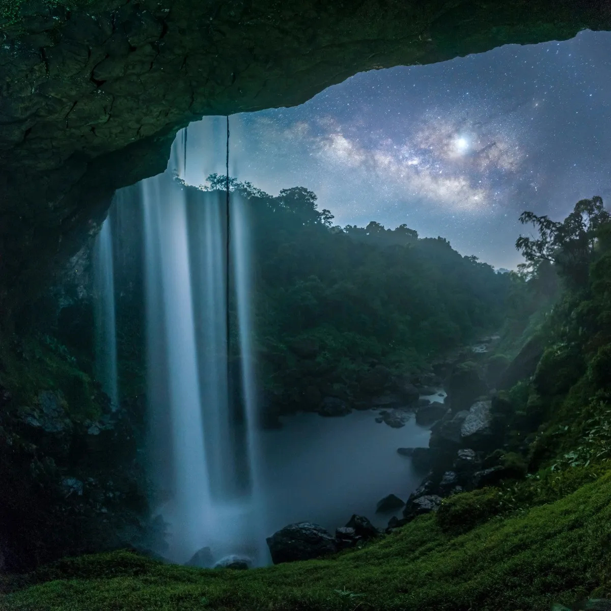 Hang En Waterfall in Gia Lai, Vietnam, becomes more mysterious and magical with the Milky Way "stretching" behind it