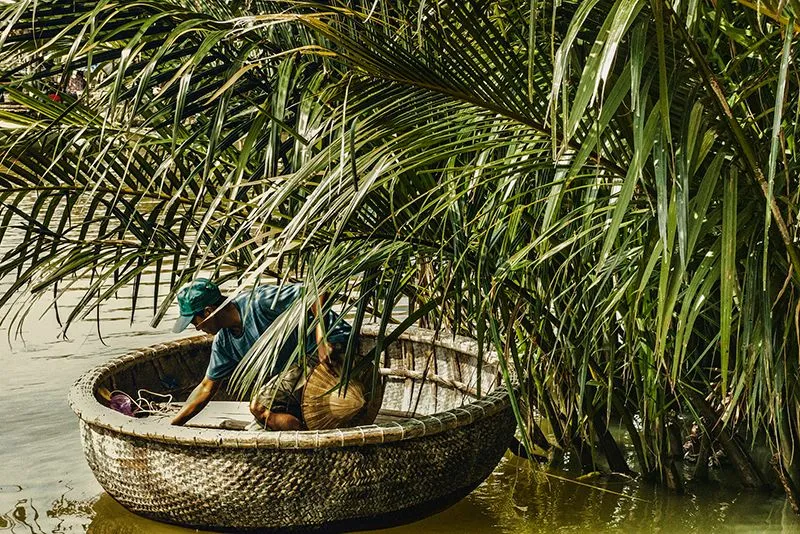 Fisherman casting a net on a river in Hoi An countryside