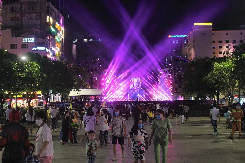 Crowd enjoying a street music performance on Nguyen Hue Walking Street