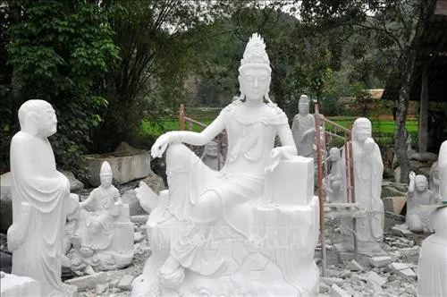 A Buddha statue crafted from white stone.