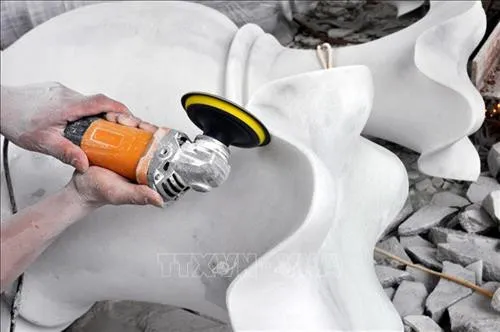 Skilled hands and machine assistance create artworks from stone.