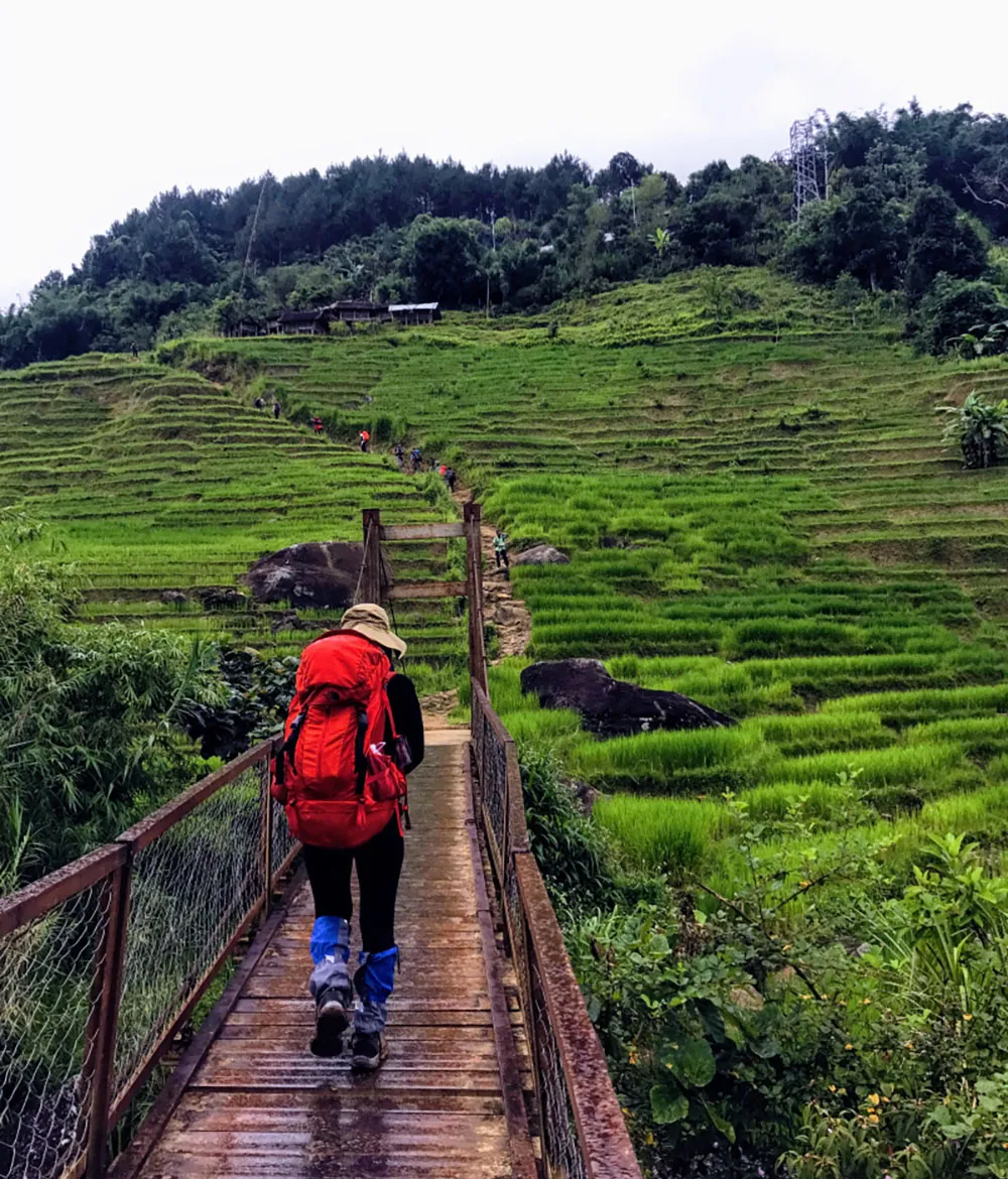 Travelers preparing hiking gear before starting their journey to conquer Mount Ngoc Linh