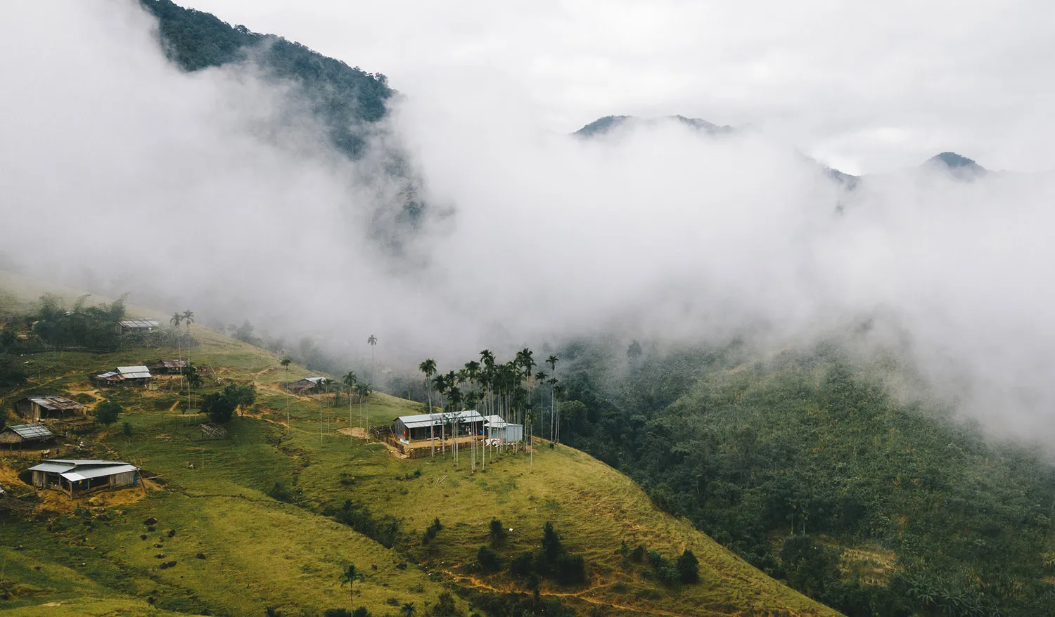 View of a Xe Dang village hidden in the mist from above