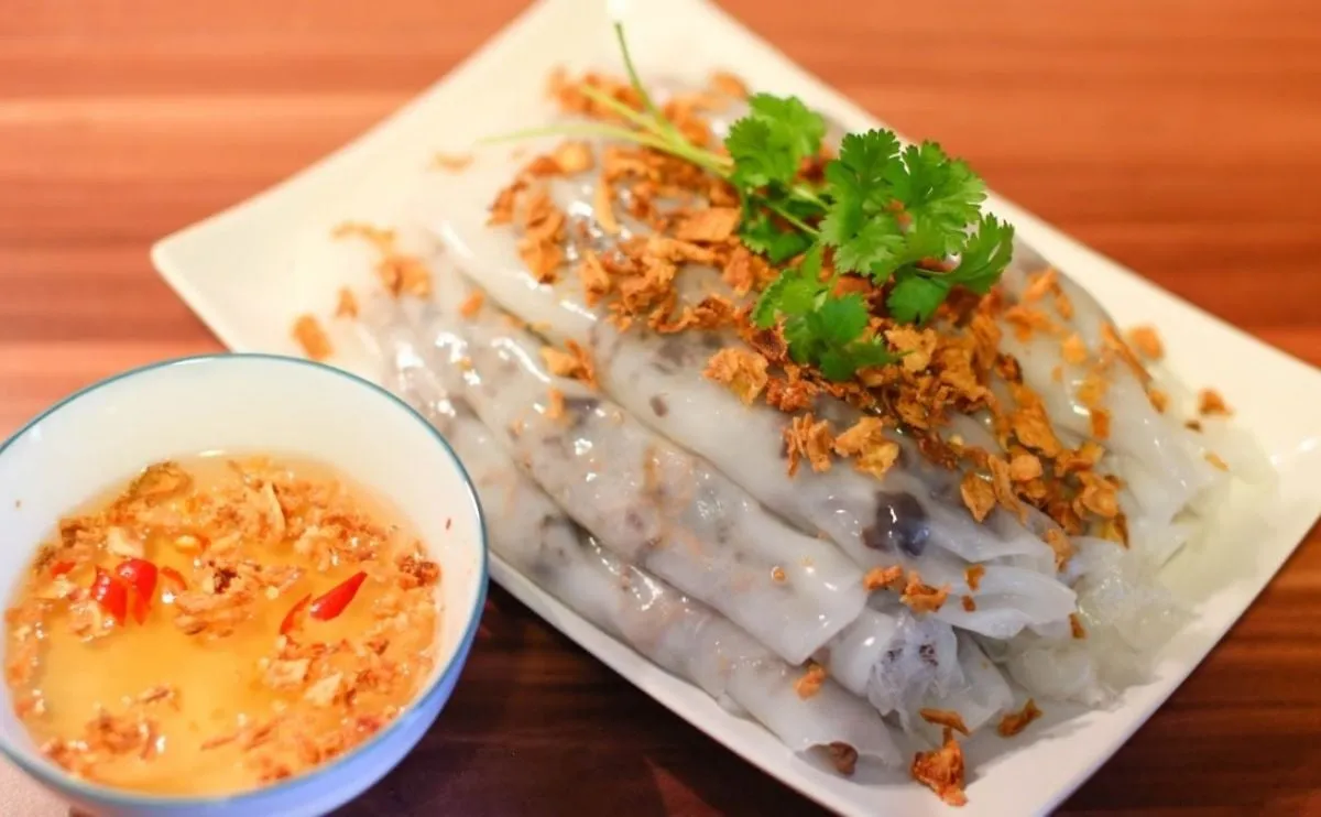 A bowl of Bun Ca Chau Doc with snakehead fish and water lilies