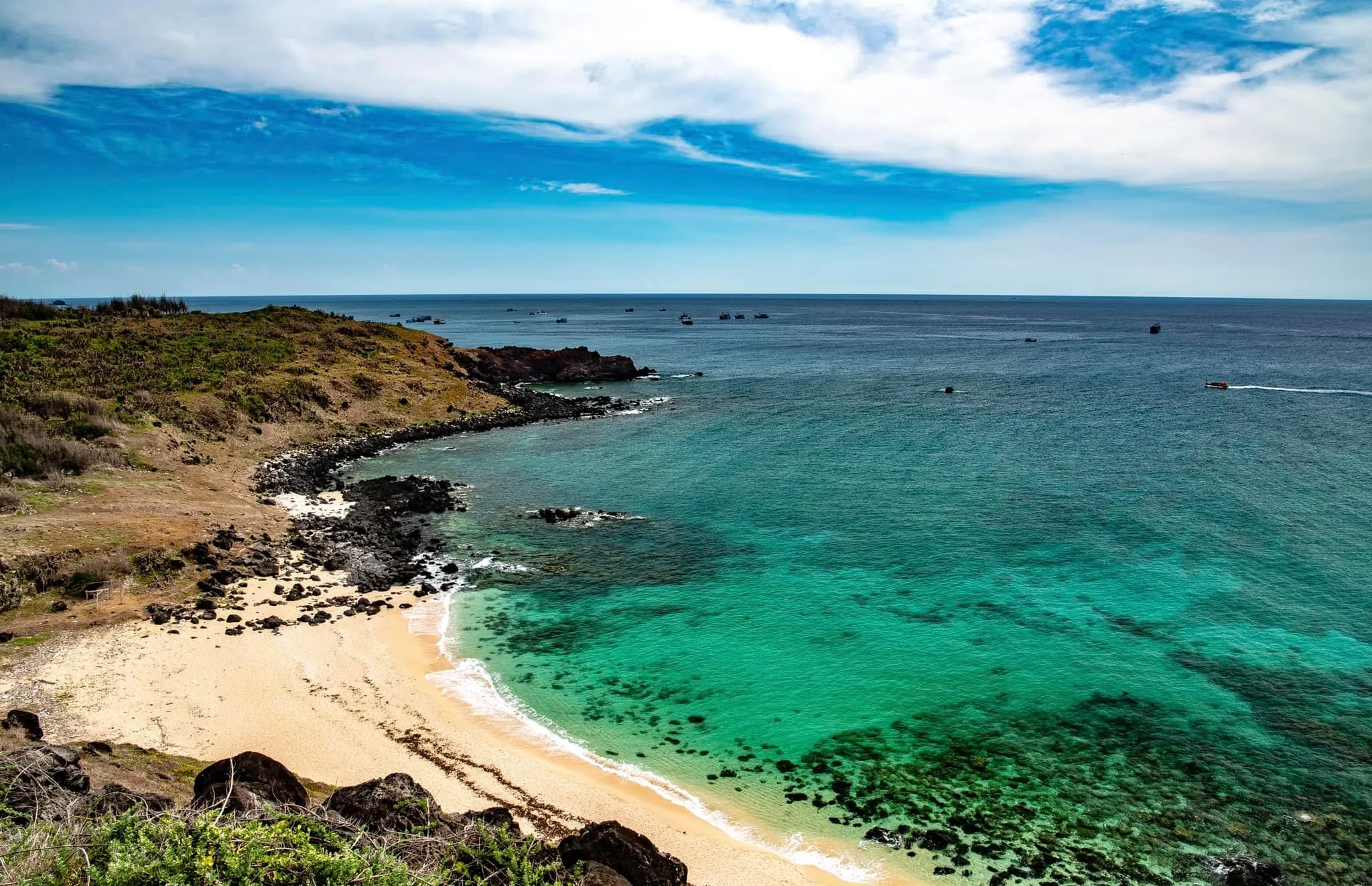 Bai Nho beach in Phu Quy with clear blue water and fine white sand