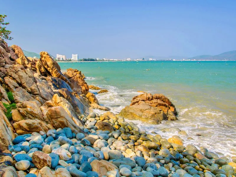 The stunning Queen Beach with colorful stones, offering a unique beach tourism experience in Quy Nhon