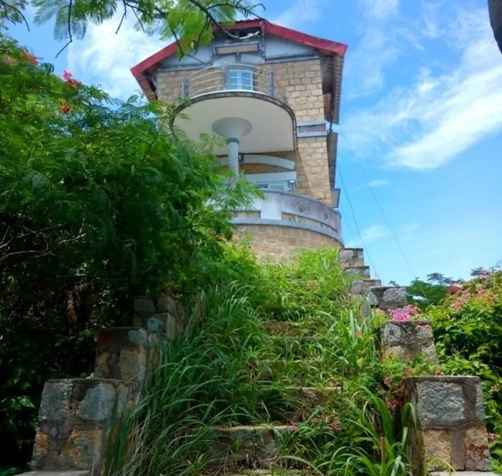 Doctor Nu's Villa showcasing French colonial architecture at Sam Mountain