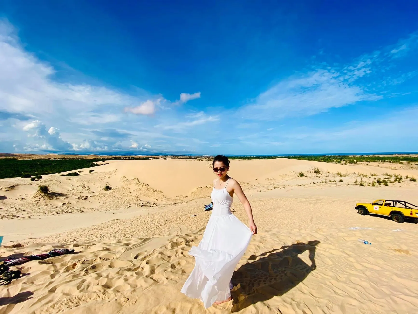 Visitors taking photos for social media at Mui Ne sand dunes