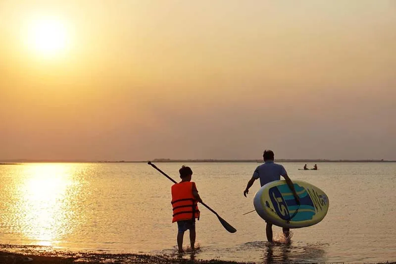 SUP paddling on Dau Tieng Lake - a popular water sport