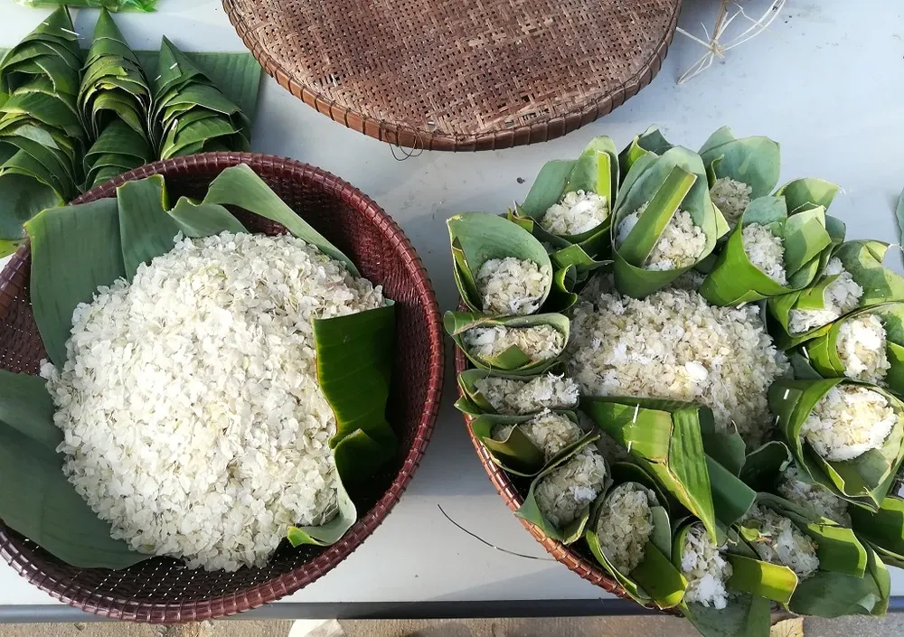 Finished Com Dep displayed on banana leaves, ready to be enjoyed or packaged