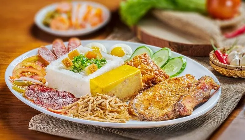 A modern and spacious Cơm Tấm Cali restaurant, a popular Saigon broken rice chain, with a clean and inviting dining area.