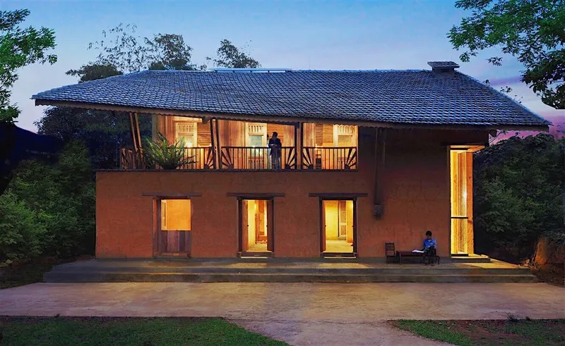 Dao Lodge Homestay with simple wooden house architecture in a green space