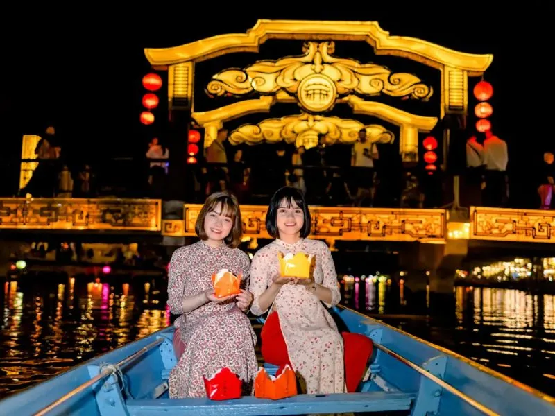 Boat ride and lantern releasing on Hoai River, a popular activity at Hoi An night market.