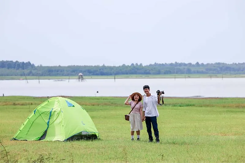Visitors camping and checking in on Nhim Island