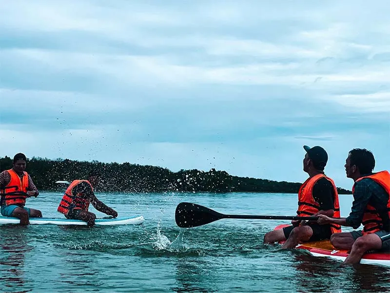 Visitors SUP paddling on the lake at Phu Gia Farm