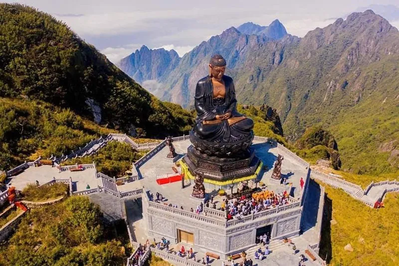 Tourists worshiping the Great Amitabha Buddha statue at the Fansipan spiritual complex
