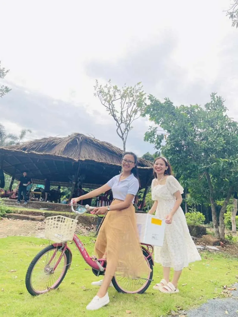 Visitors cycling by Dau Tieng Lake at Bang Lang Glamping