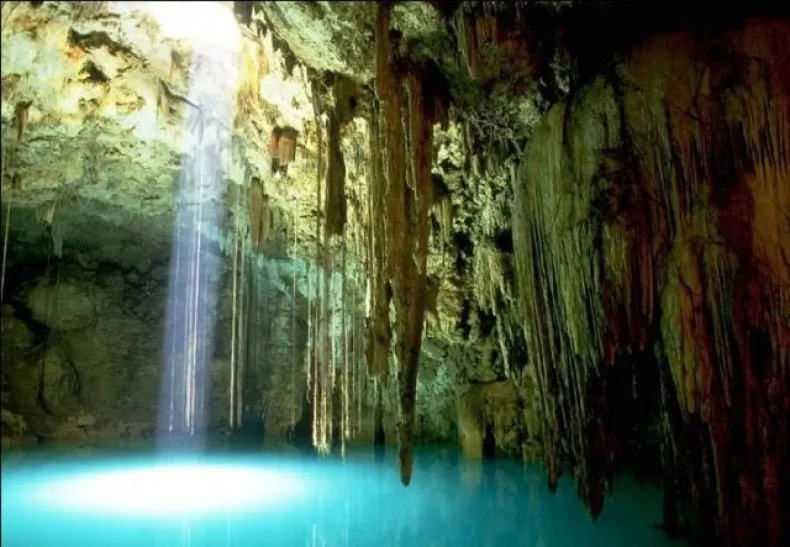 Tourists exploring Paradise Cave during the dry season