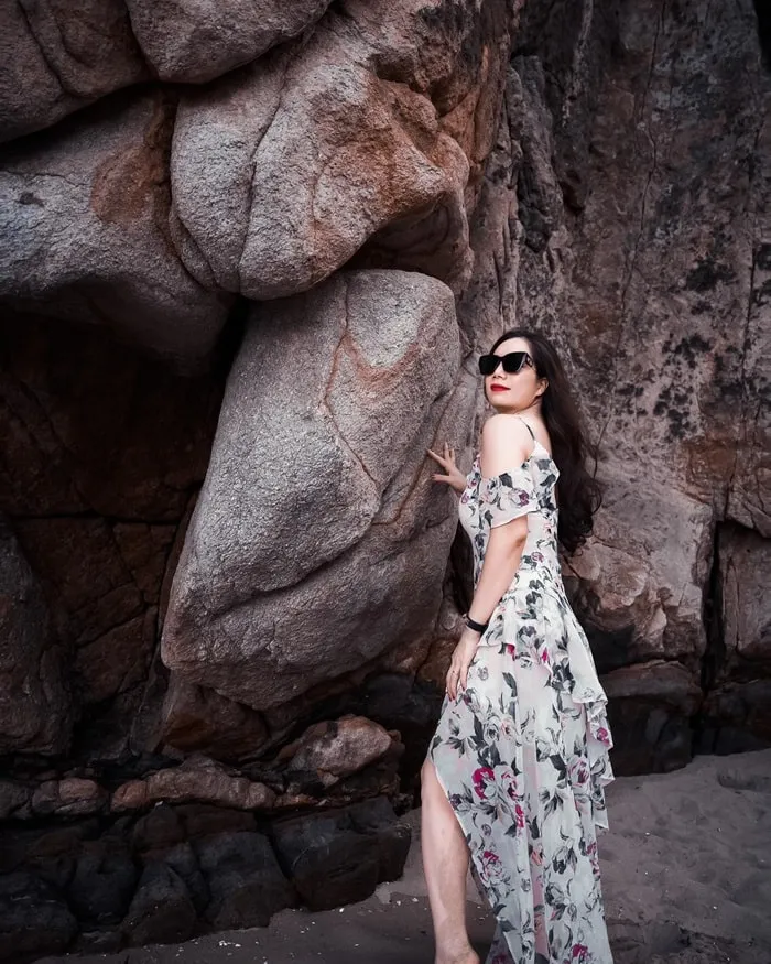 Tourists climbing on the rocks at Sam Son to admire the panoramic view of the vast sea and enjoy the fresh air