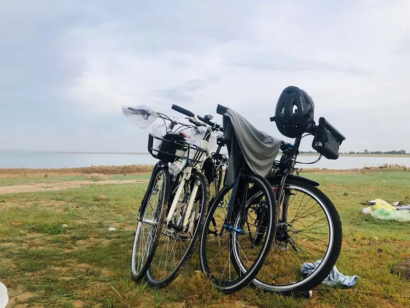 Visitors cycling to Dau Tieng Lake