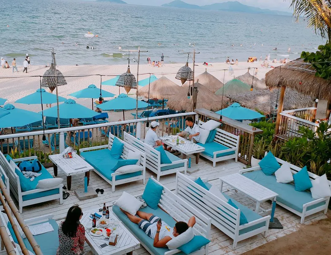 Tourists enjoying the relaxing atmosphere at An Bang beach