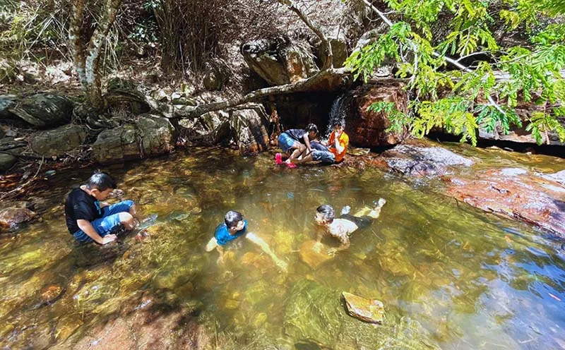 Visitors enjoying swimming at Truc Stream