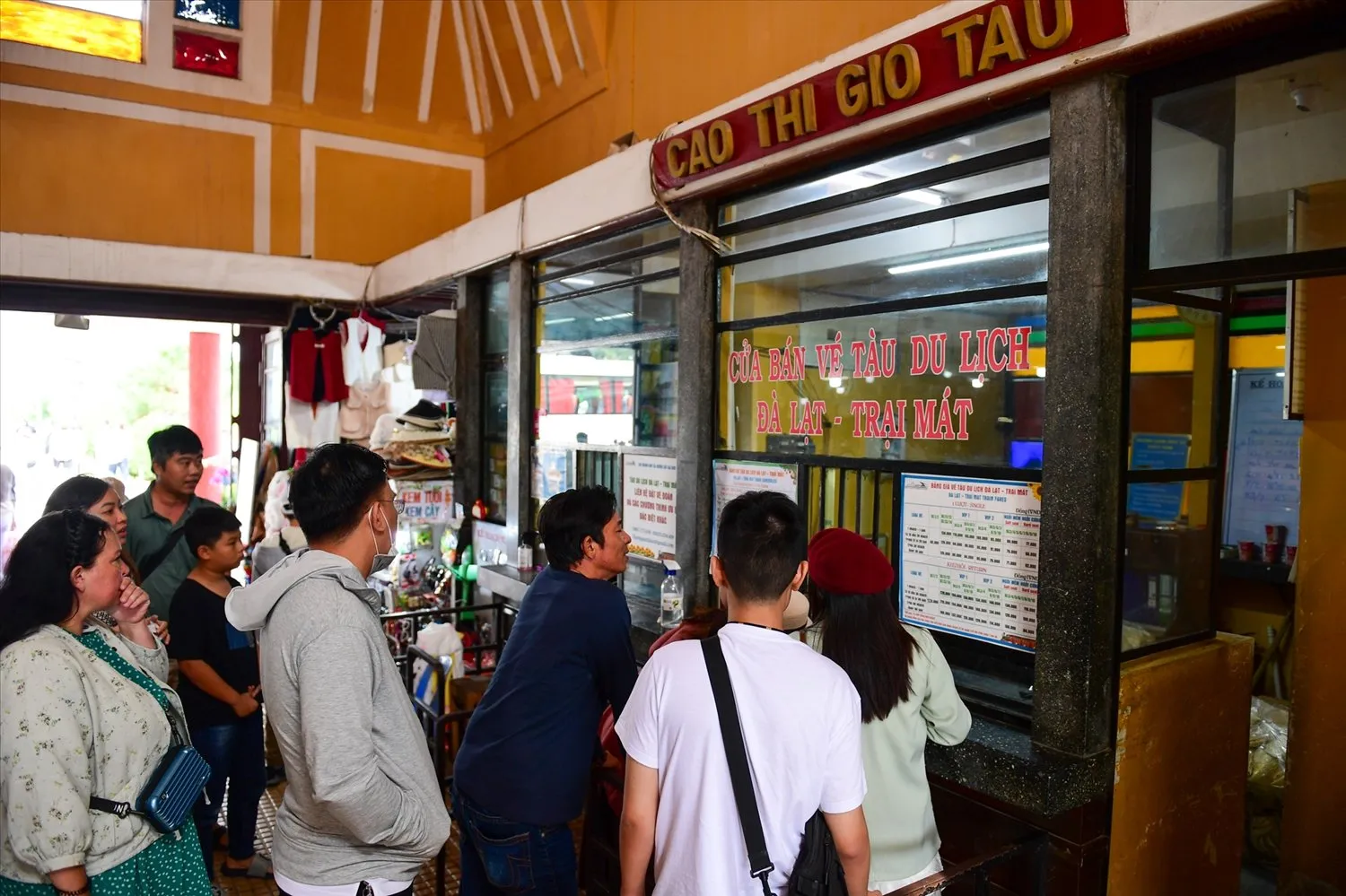 Tourists enjoy queuing to buy tickets at the vintage ticket office of Da Lat station