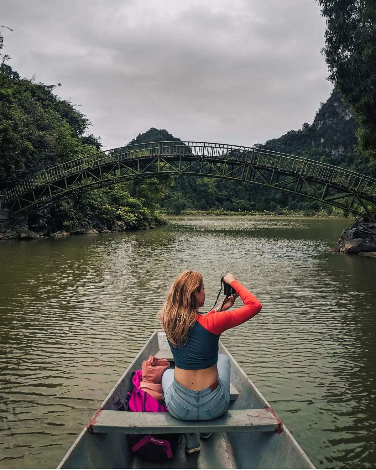 Tourists relax fishing by the clear lake in Thung Nham Ecotourism Area