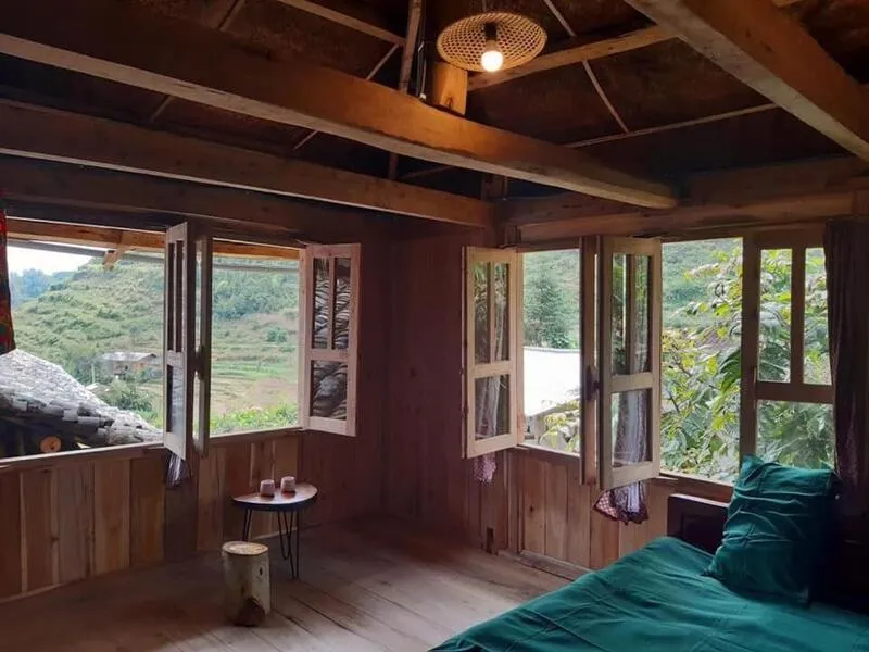 Tourists relaxing at Dong Van Homie Homestay, immersed in nature
