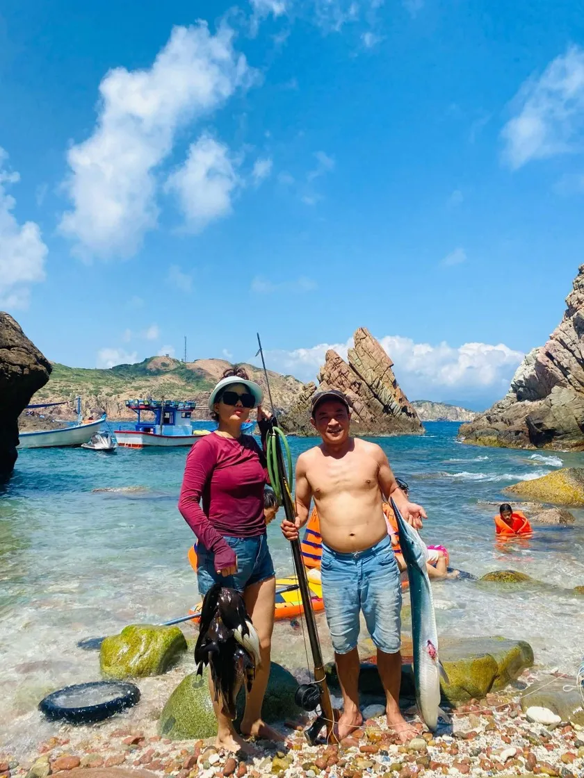 Tourists enjoying fishing in Hon Seo, a popular activity in Vietnamese fishing villages.