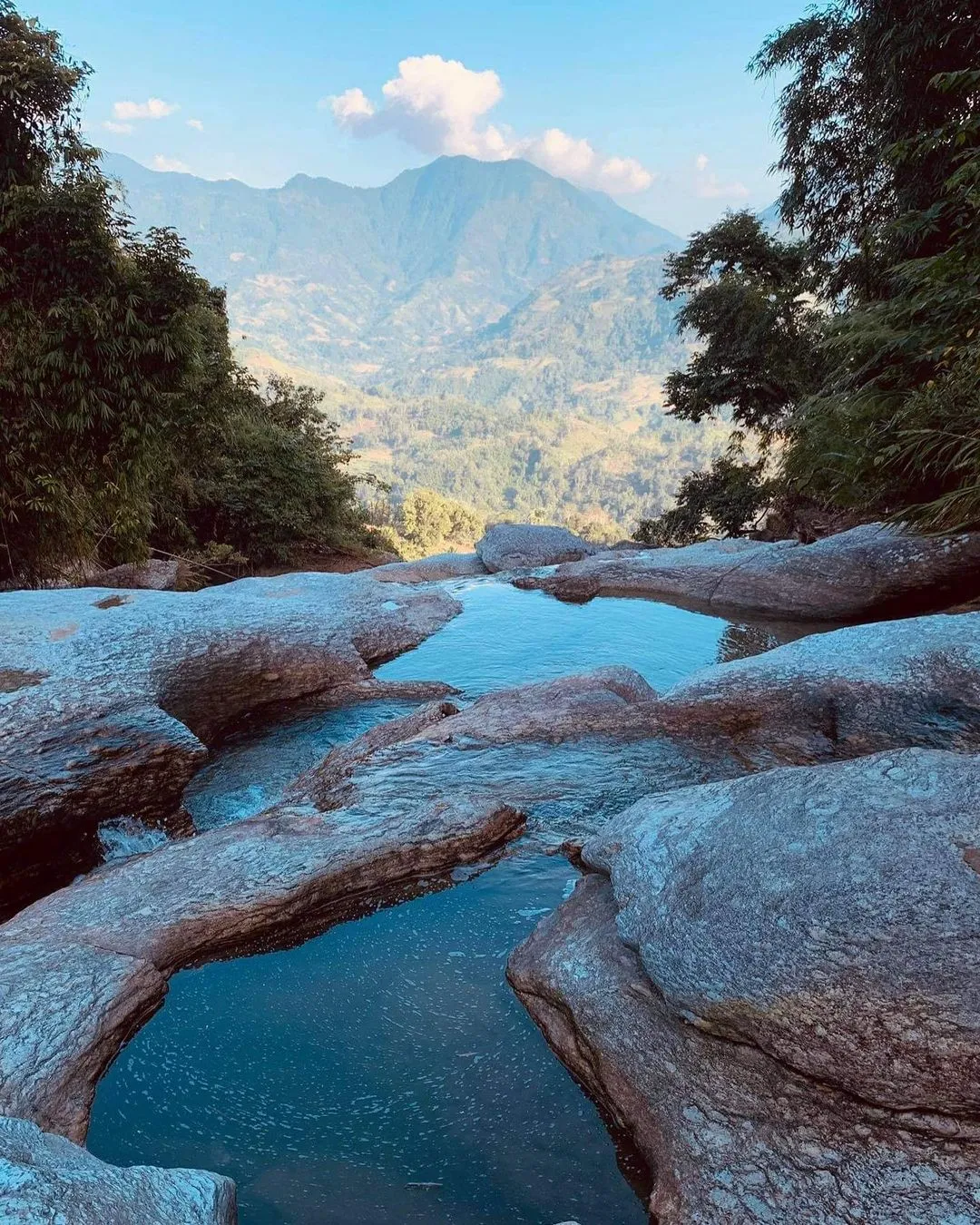 Stop and take photos for social media amidst the majestic nature on the Tay Con Linh cloud hunting trekking tour.