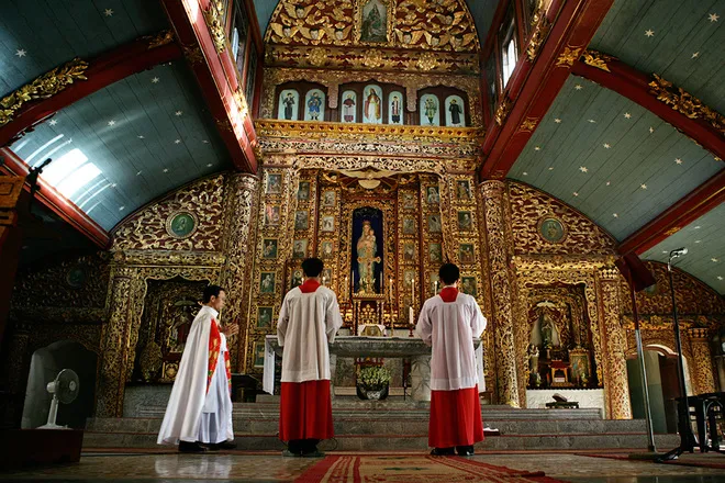 The sanctuary inside the large church with a delicately carved stone altar