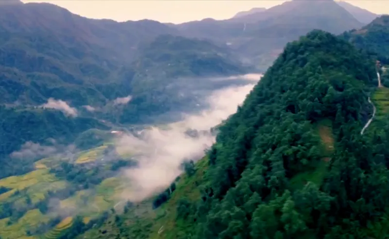 View from inside the train carriage looking out at the Sapa scenery