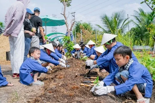 Children participating in fishing activity at Long Thoi Farm