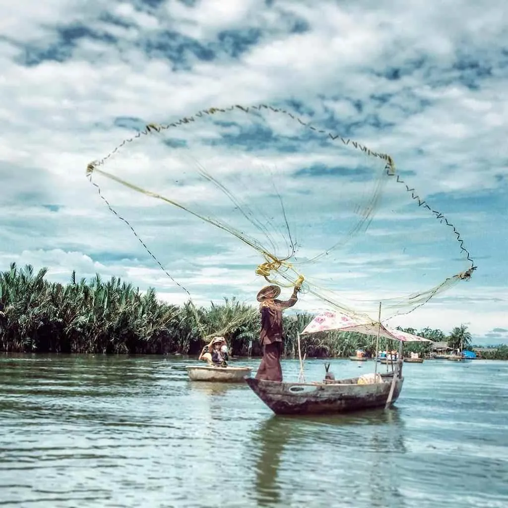 Local people fishing on the Thu Bon River, a familiar and peaceful scene.