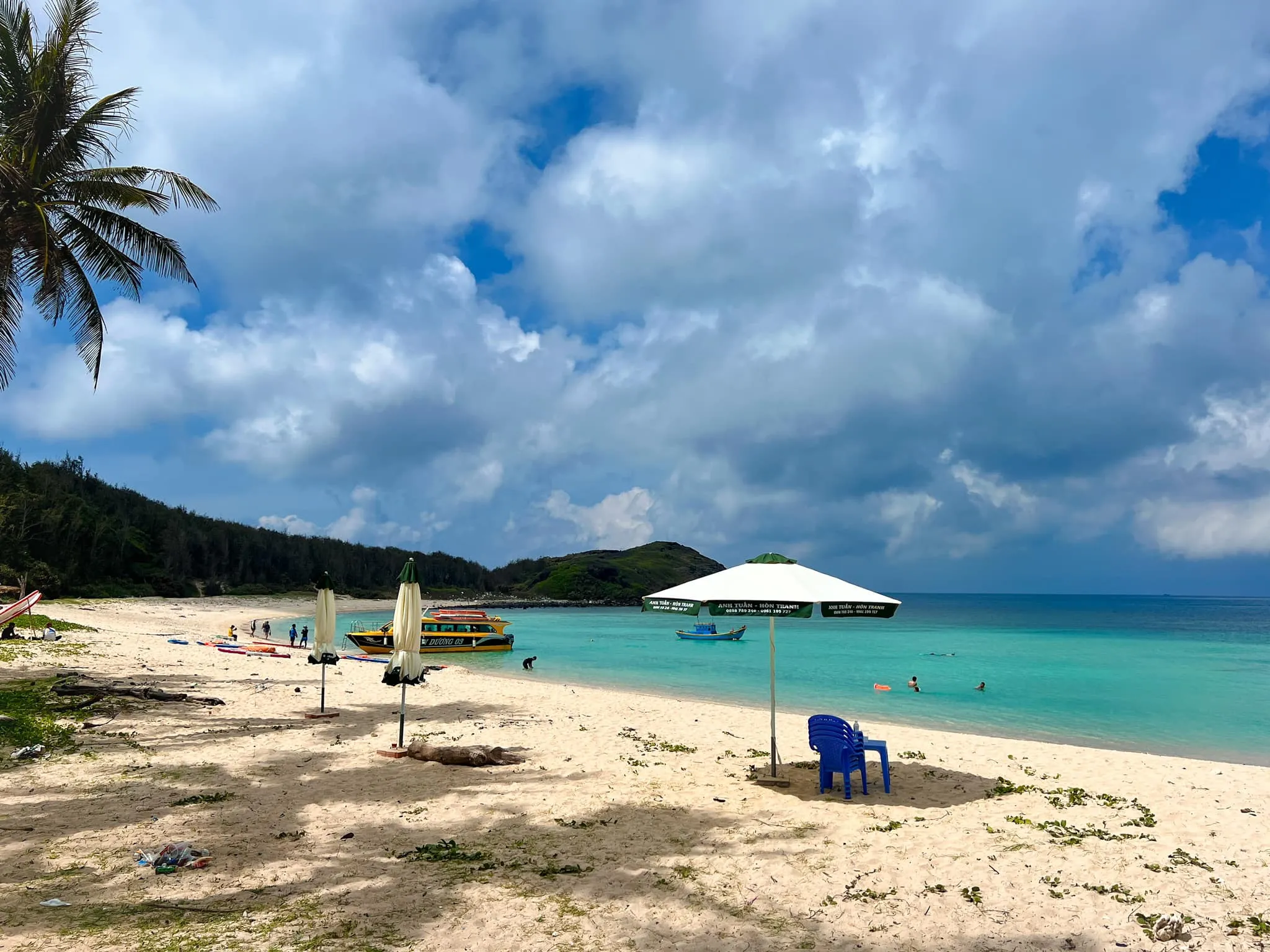 Hon Tranh Island in Phu Quy with clear blue sea water and fine white sand beach