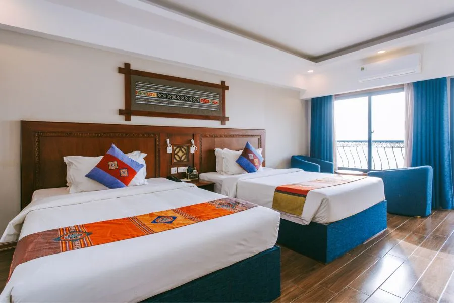 Sapa Charm hotel with modern architecture and panoramic town view