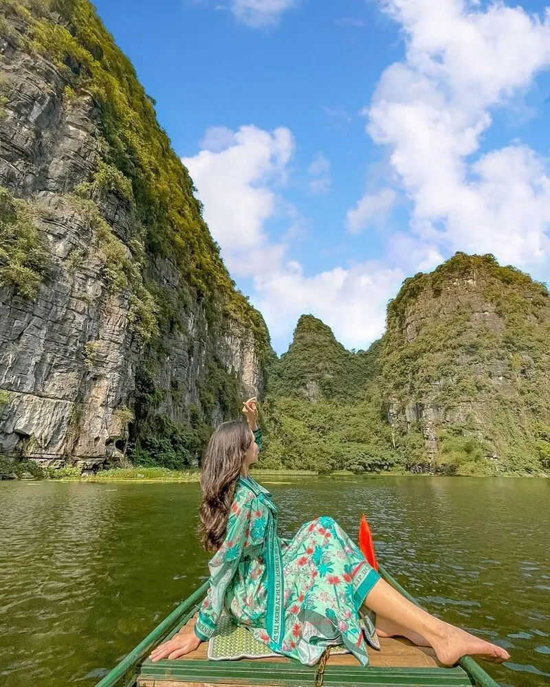 Exploring the Trang An cave system by boat
