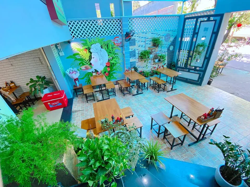 The interior space of Trang Neko Food restaurant is delicately and warmly designed