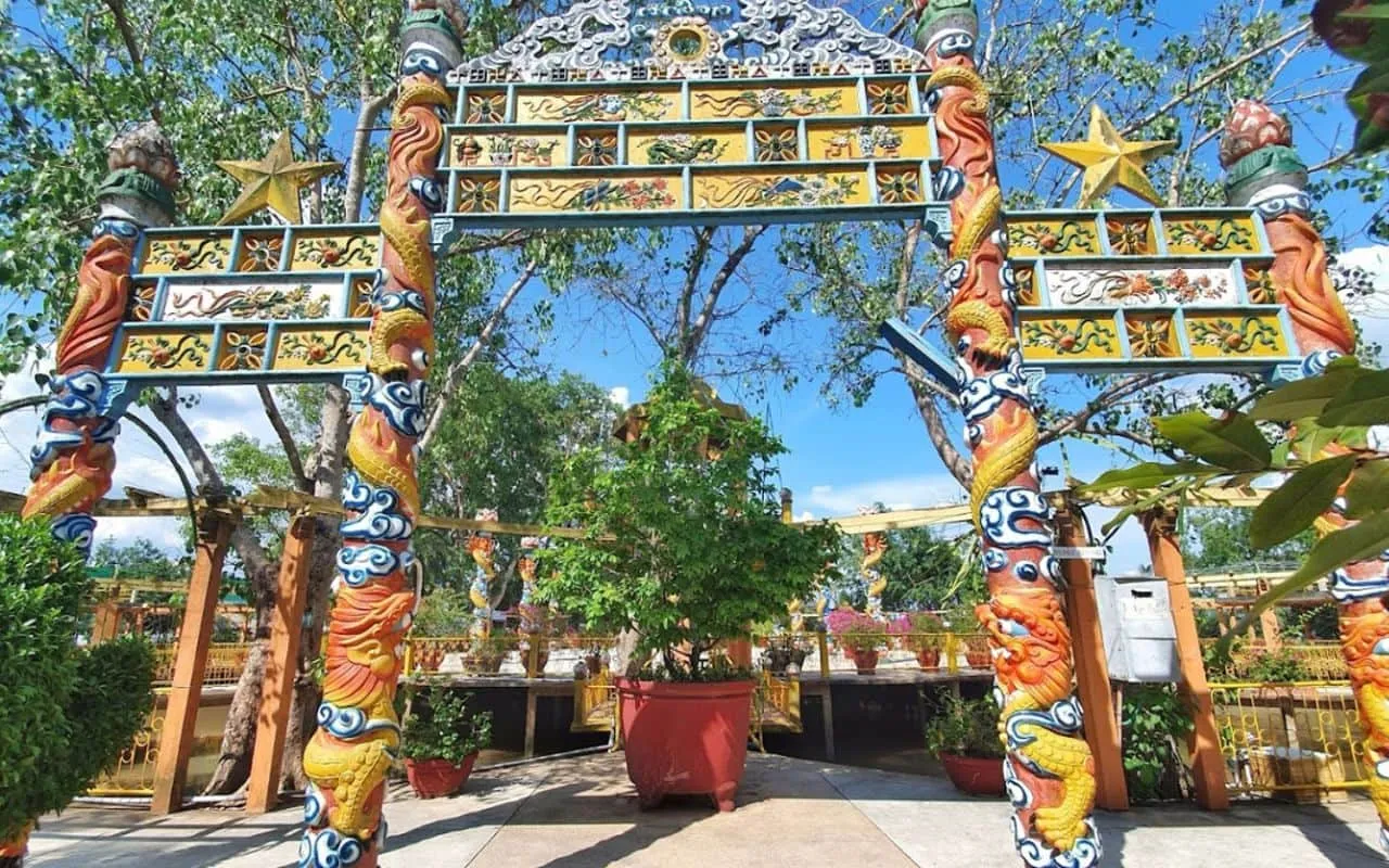 Coconut Religion Relic Site featuring unique architecture and intricately dragon-carved pillars at Con Phung Island