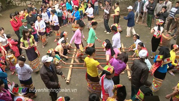 A re-enactment of a traditional festival in Phay Thai Minh village, Nghe An, Vietnam, drawing tourists.
