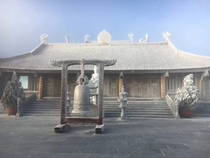 Snow-covered spiritual architectural structures on Fansipan peak