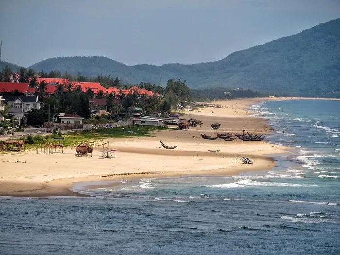 Lang Co fishing village with majestic natural scenery, where the blue sea blends with rolling mountains.