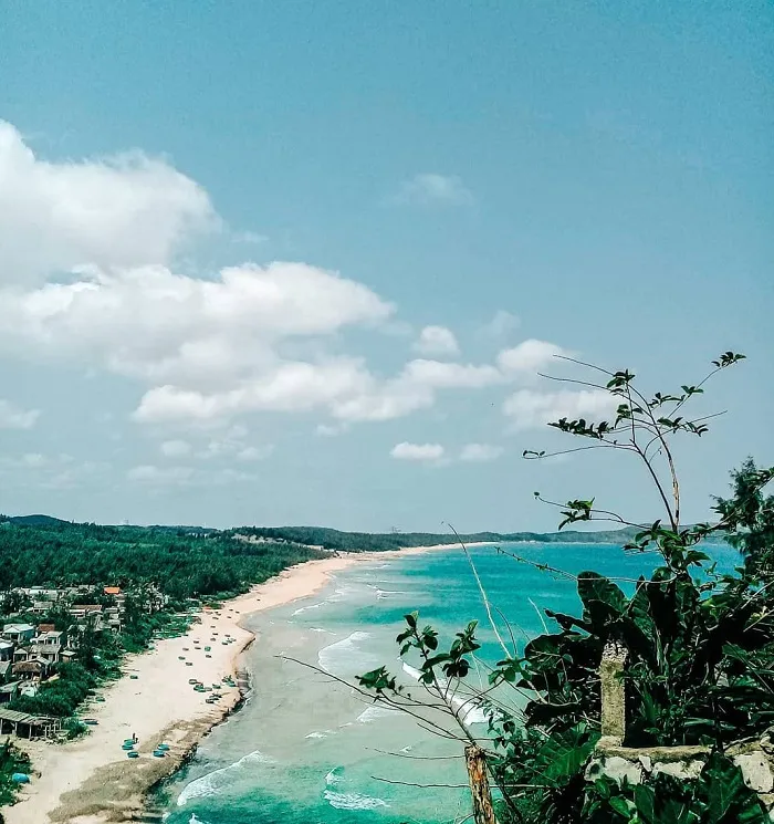 Peaceful Le Thuy fishing village under the shade of green casuarina trees, a quiet and relaxing space.